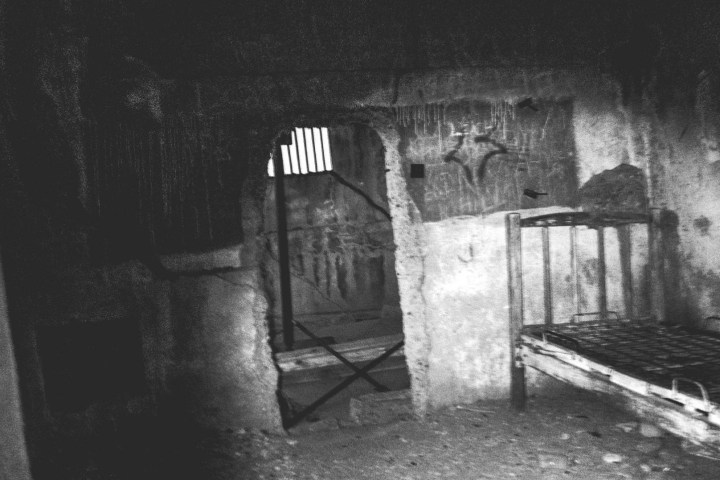 a vintage photo of an old spooky building interior